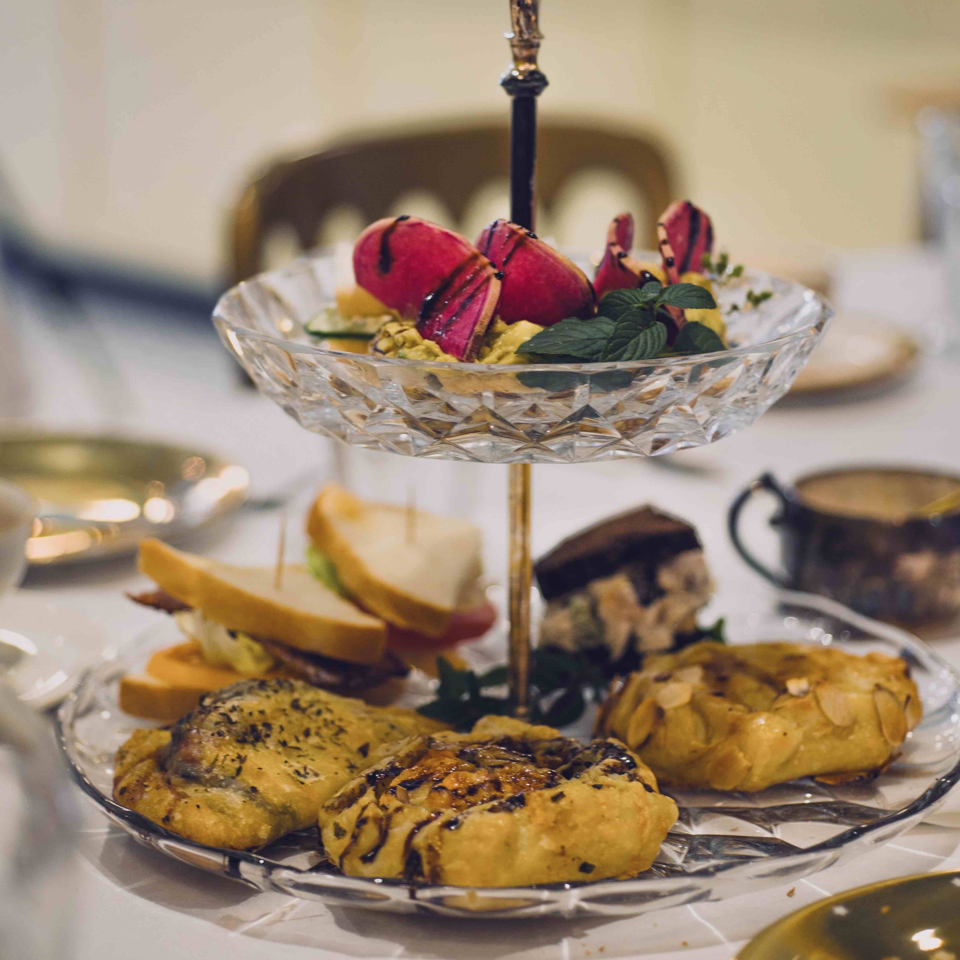 A glass tower of high tea finger foods.