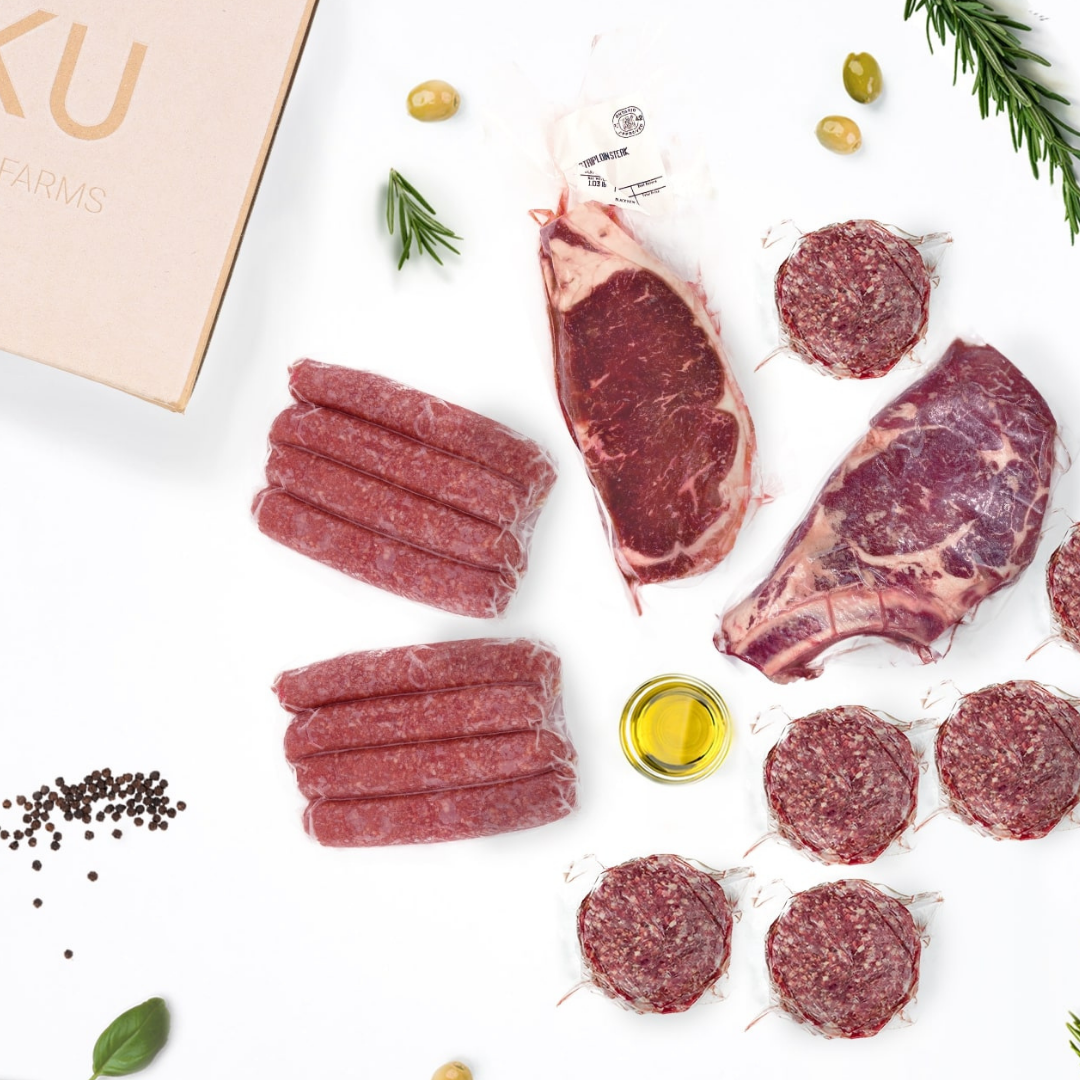 An unboxed NIKU Farms meat subscription box with pasture raised and grass fed beef.