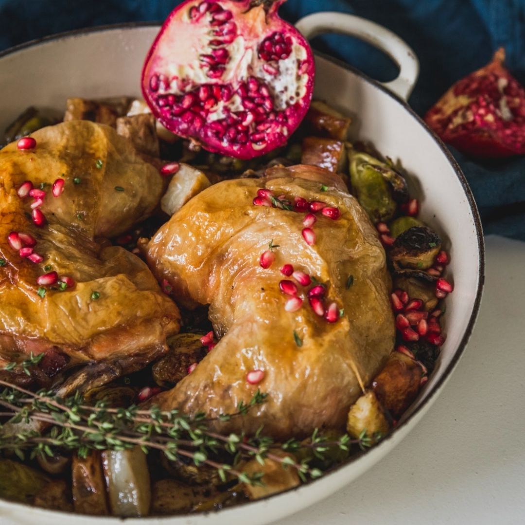 Roast chicken right out of the oven, topped with pomegranate.