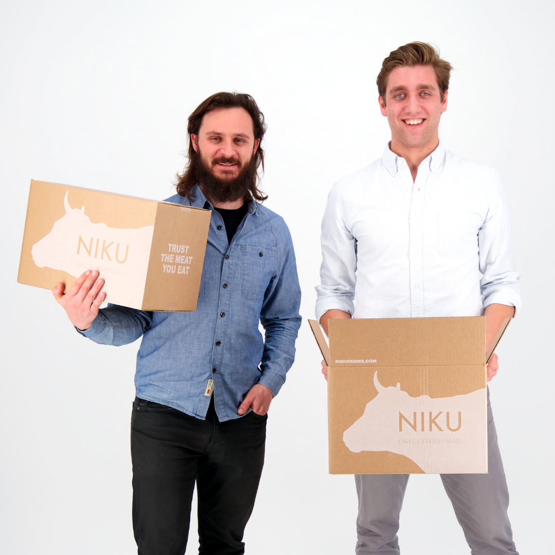 NIKU Farms Co-Founders Jake Goldberg and Luke Armstrong holding NIKU Farms boxes.